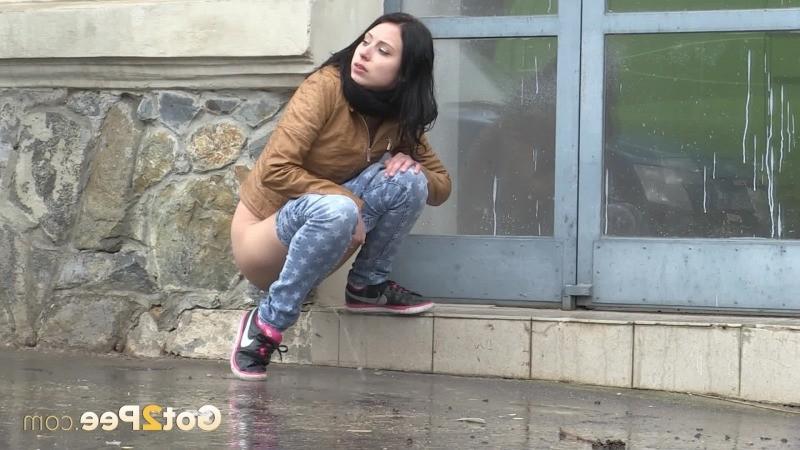 15P Gorgeous dark haired girl pees in public
