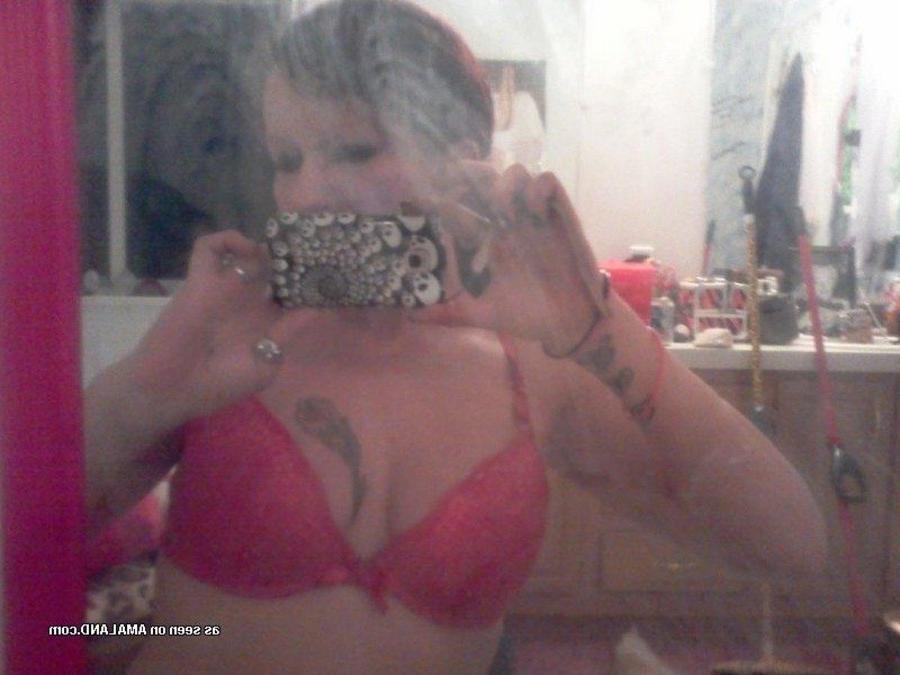 12P Tattooed chick self-shooting in front of the mirror