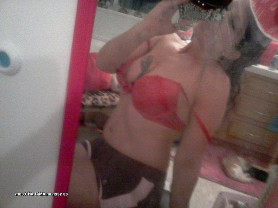 12P Tattooed chick self-shooting in front of the mirror