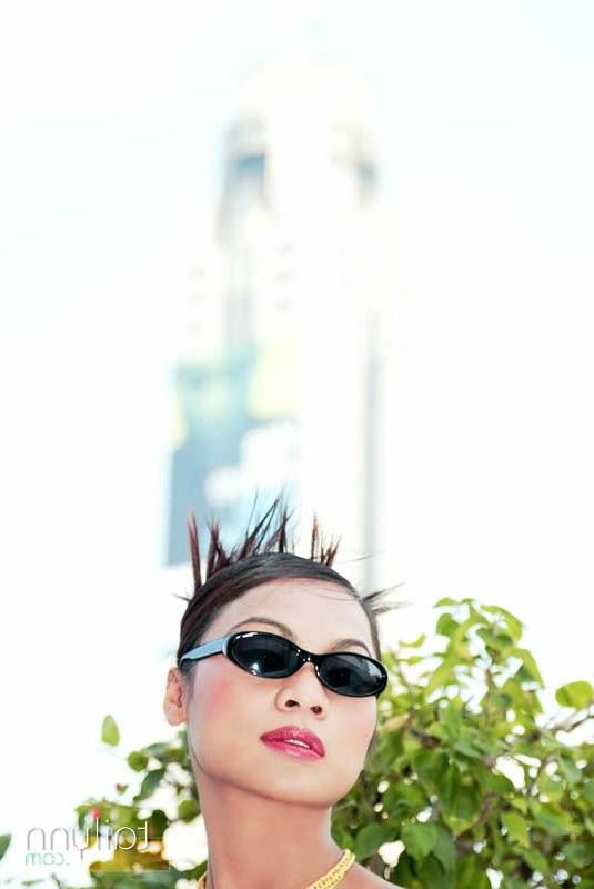 15P Glamour Thai model Tailynn poses outdoors