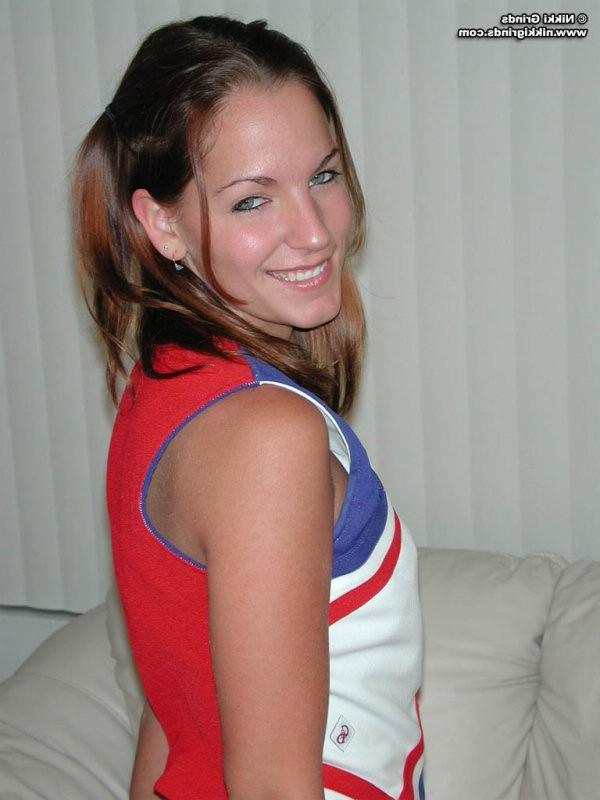 15P Nikki strips from a hot cheerleader uniform