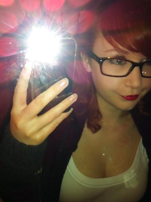20P A beautiful young red-haired girl with glasses