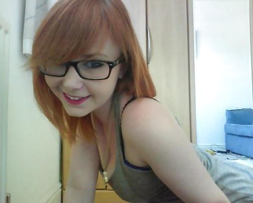 20P A beautiful young red-haired girl with glasses