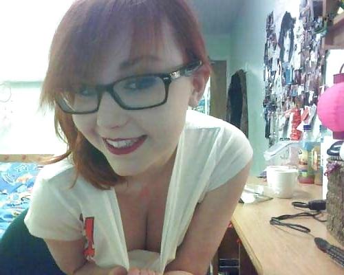 20P A beautiful young red-haired girl with glasses