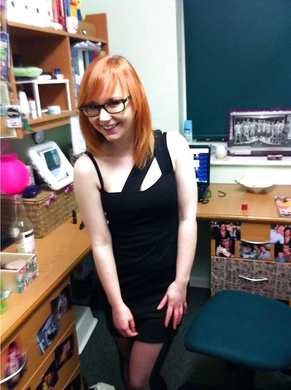 20P A beautiful young red-haired girl with glasses