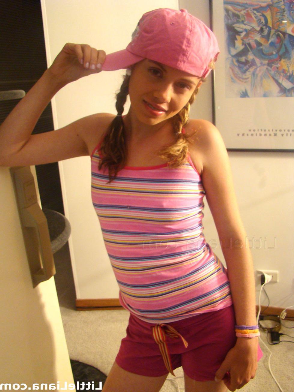12P Cute young thing takes pictures in front of mirror with her own cam