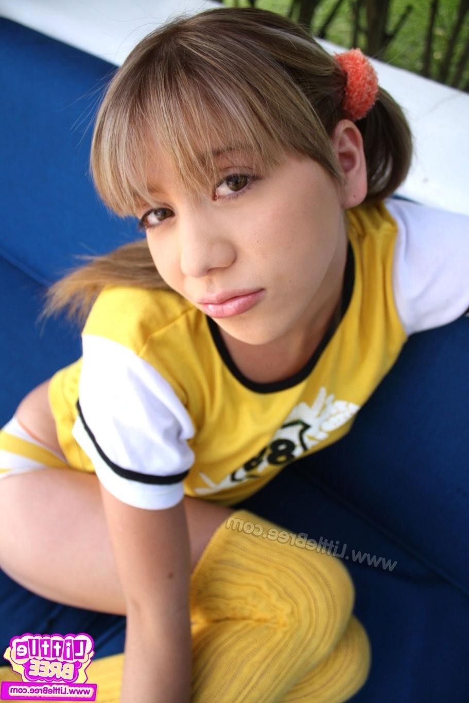 12P Sexy little cheerleader shows her small body.