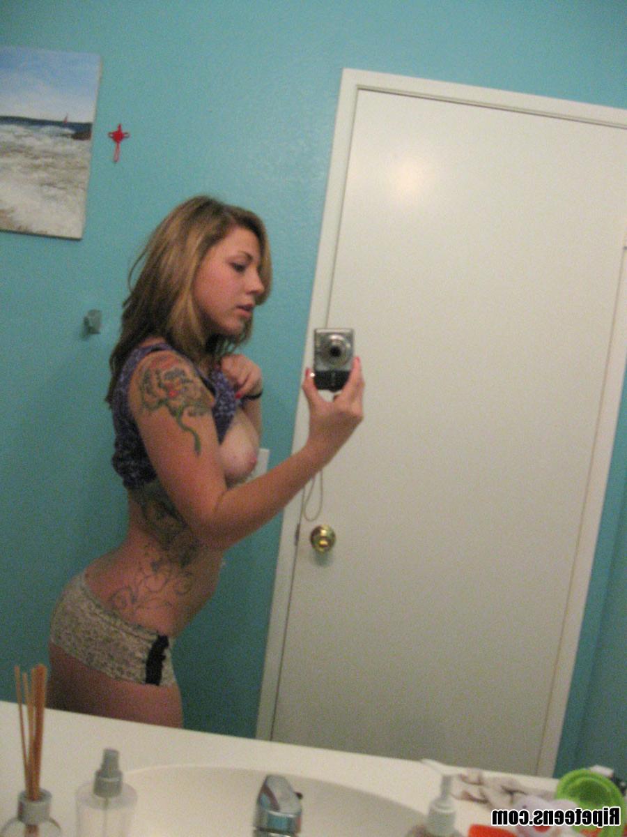 16P Tattoed Kadence taking pictures in the bathroom