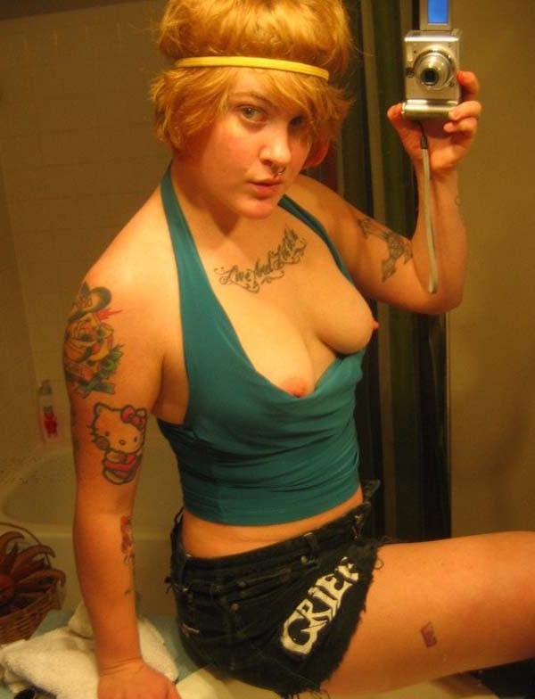 12P Tattooed Emo red haired babe at home
