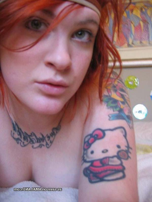 12P Tattooed Emo red haired babe at home