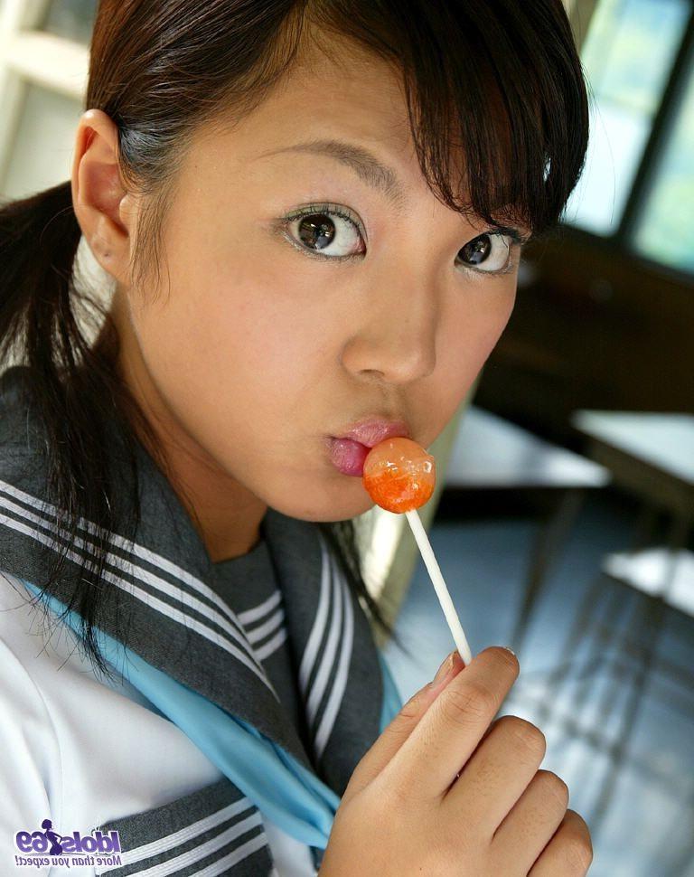 16P Japanese tramp poses in her sexy bathing suit outside