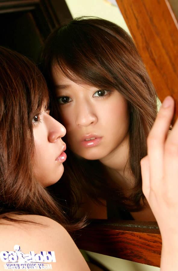 15P Sexy asian babe posing in front of a mirror