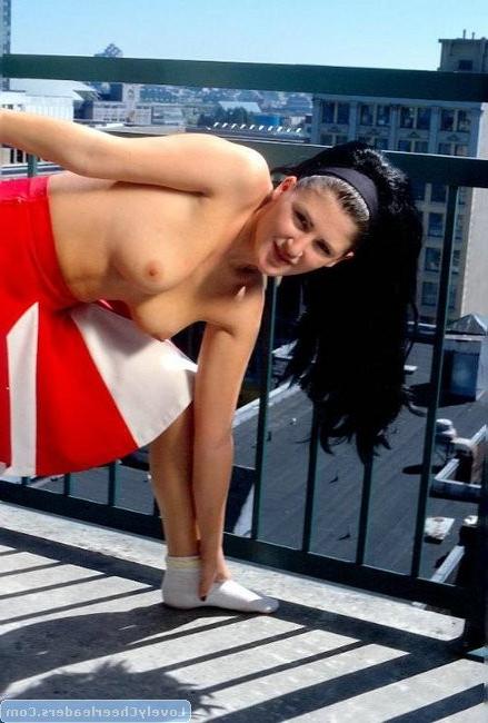 15P Horny cheerleader Eve shows her assets outdoors