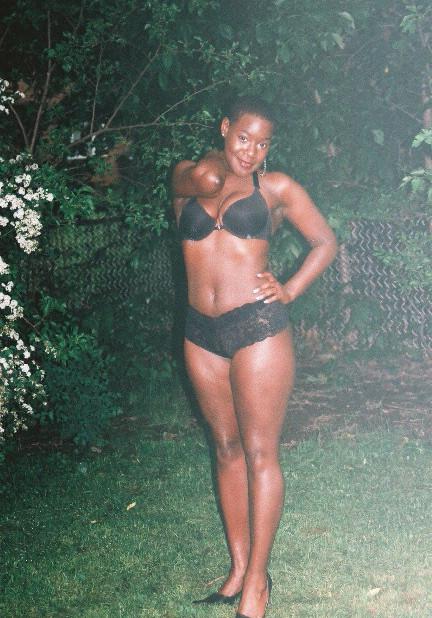 16P Short haired black chick posing and showing her ass
