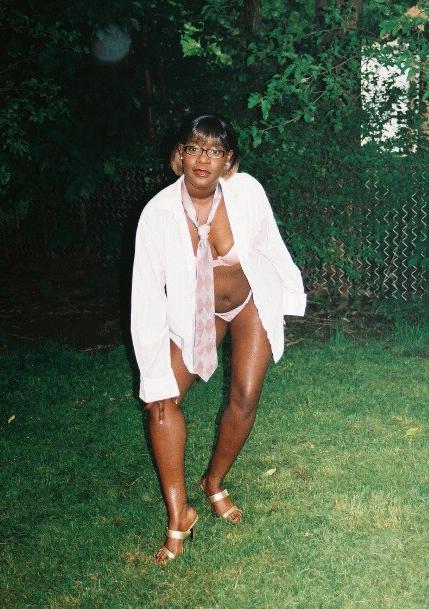 16P Short haired black chick posing and showing her ass