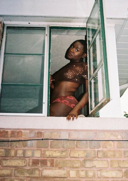 16P Short haired black chick posing and showing her ass