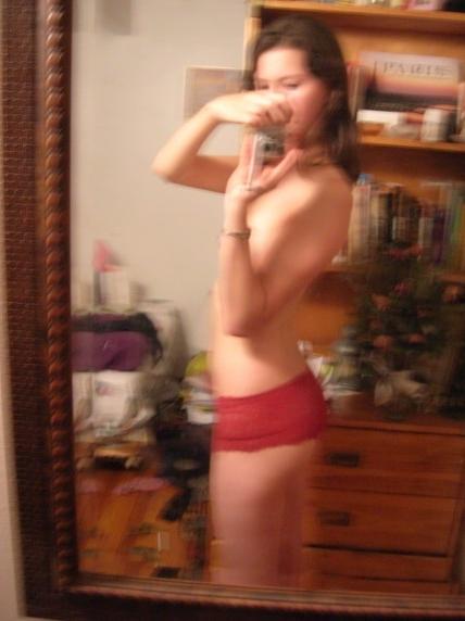 10P Curly girly in red panties poses bare titted on home camera