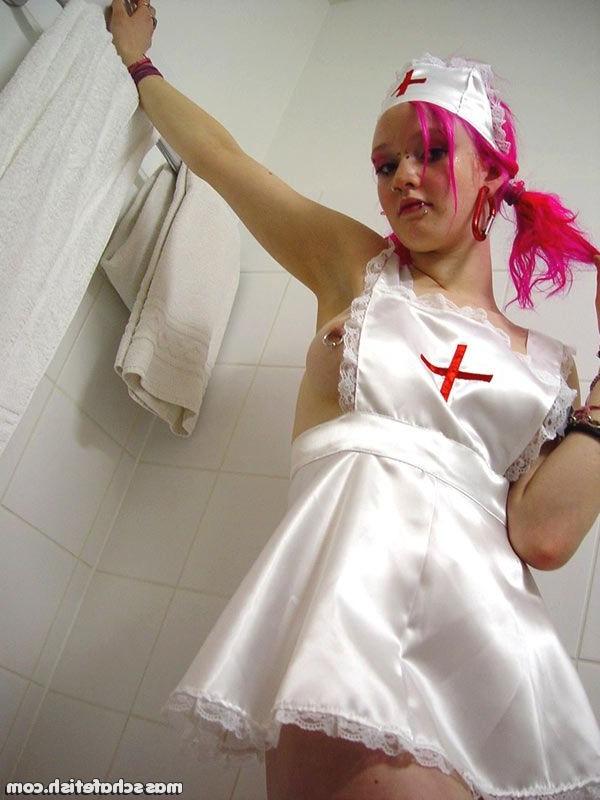 16P Pink haired goth chick Masscha trying out her sexy nurse outfit