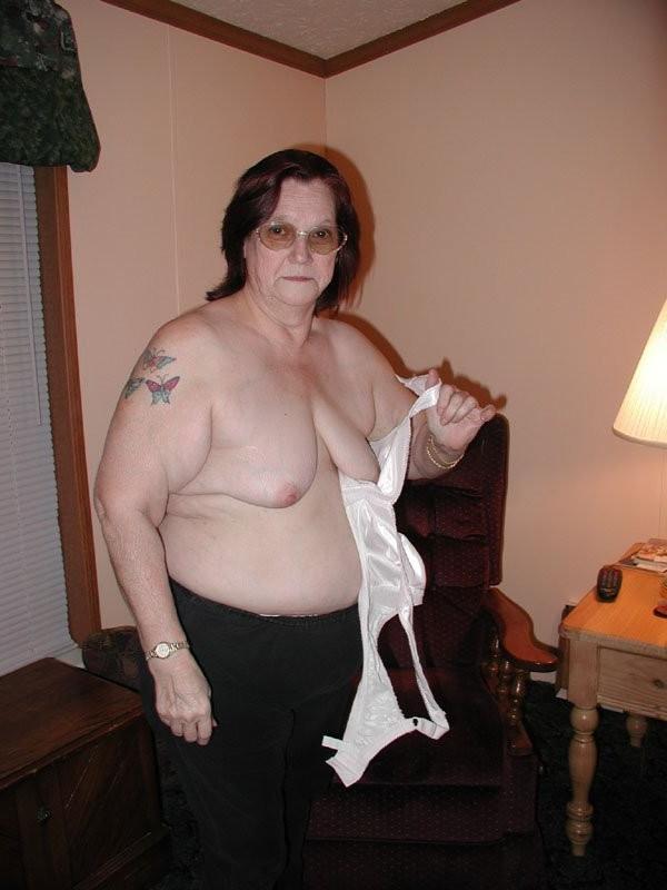 16P Old fat granny striping and spreading wide her large hairy twat