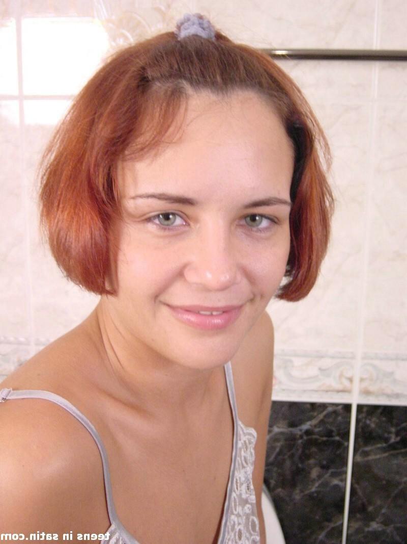 16P Slutty teen redhead shows off her bald wet pussy
