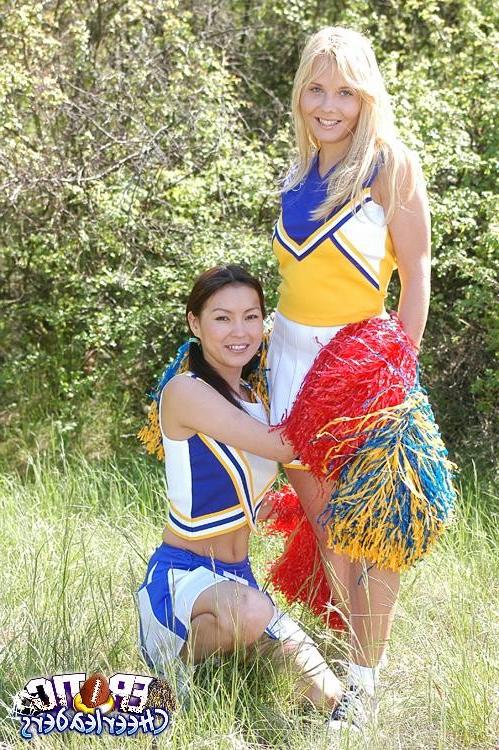 15P Two ultra sexy cheerleaders stripping and licking their pussies outdoors
