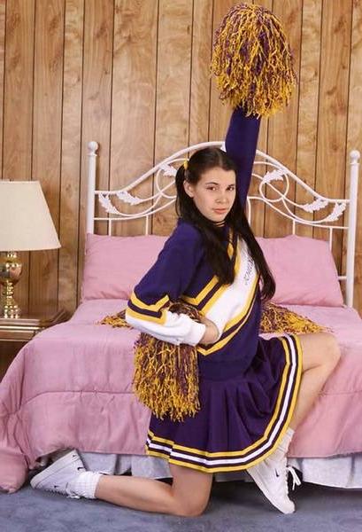 15P Brunette Cheerleader spreading her skinny butt