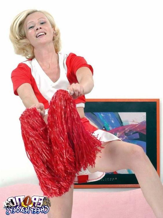 15P Skinny blond cheerleader strips and toys her pink snatch