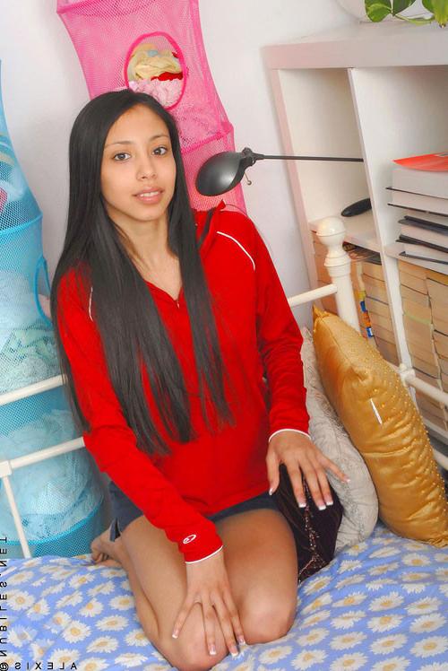 10P Dark haired cutie laughs and strips for the camera