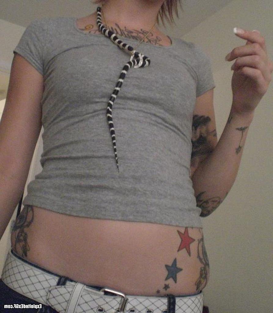 15P Amateur girl with lots of tattos posing