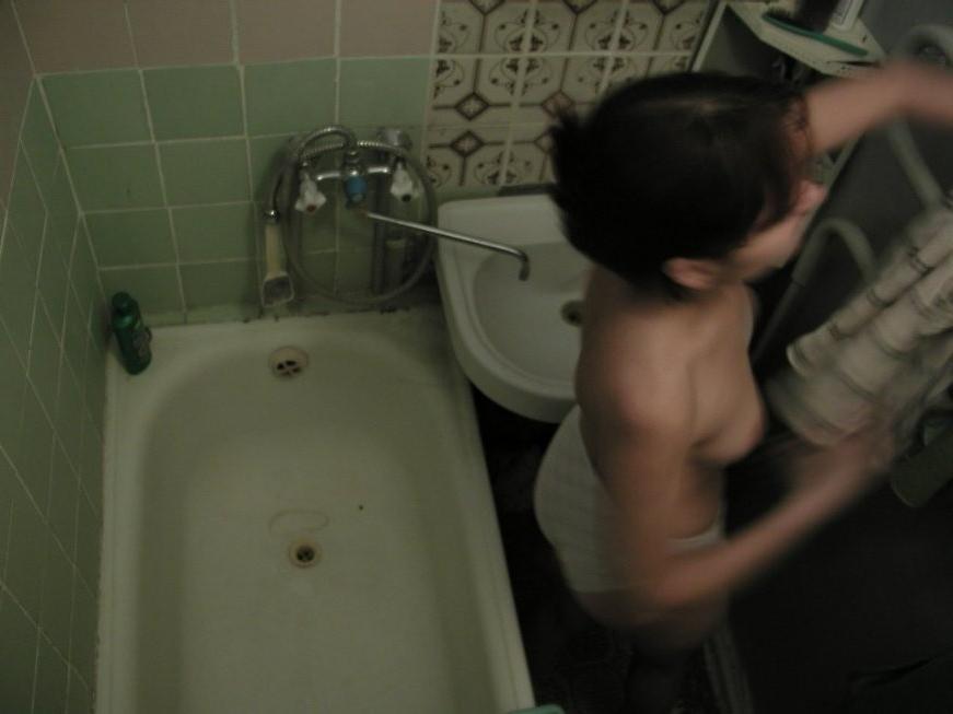 16P Ceiling voyeur hidden cam catches brunette babe in the shower