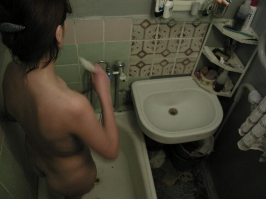16P Ceiling voyeur hidden cam catches brunette babe in the shower