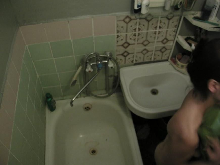 16P Ceiling voyeur hidden cam catches brunette babe in the shower