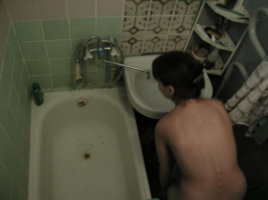 16P Ceiling voyeur hidden cam catches brunette babe in the shower