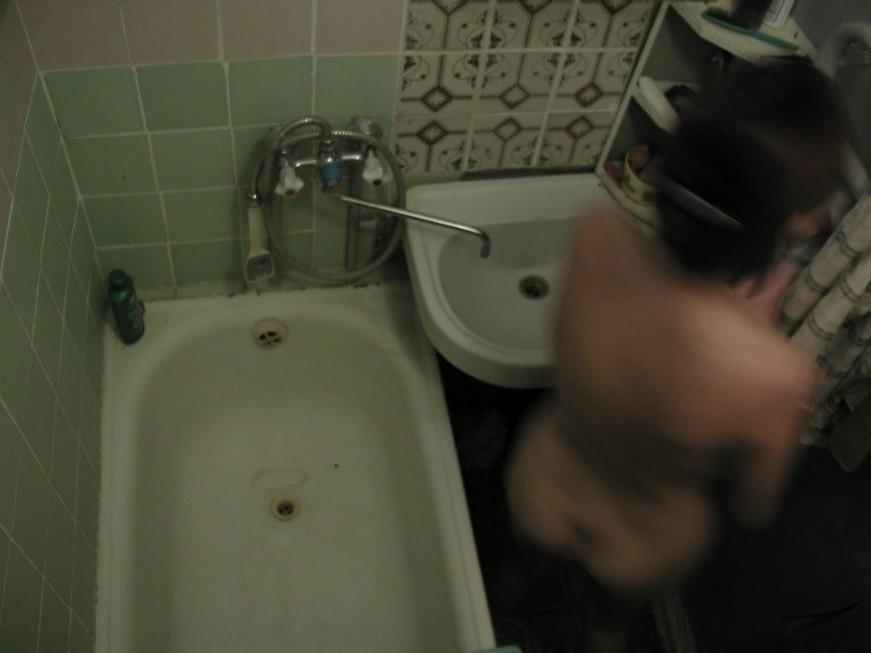 16P Ceiling voyeur hidden cam catches brunette babe in the shower