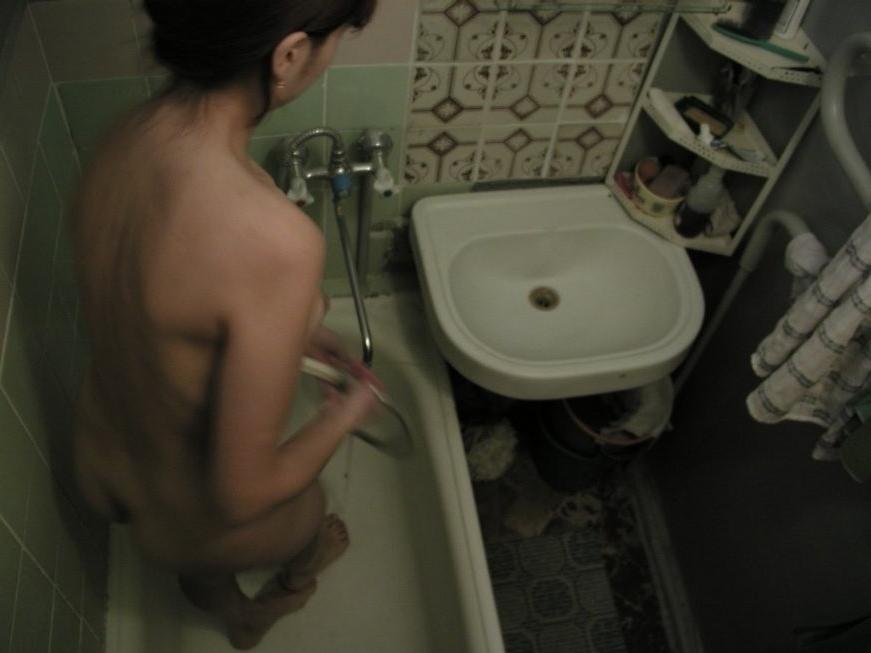16P Ceiling voyeur hidden cam catches brunette babe in the shower