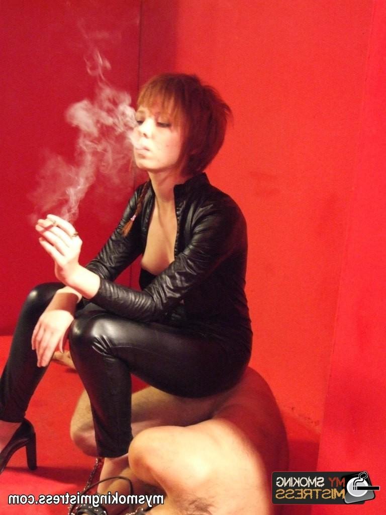 8P Smoking short haired lady in latex outfit kinkily uses her slave as an ashtray