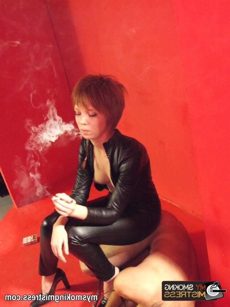 8P Smoking short haired lady in latex outfit kinkily uses her slave as an ashtray