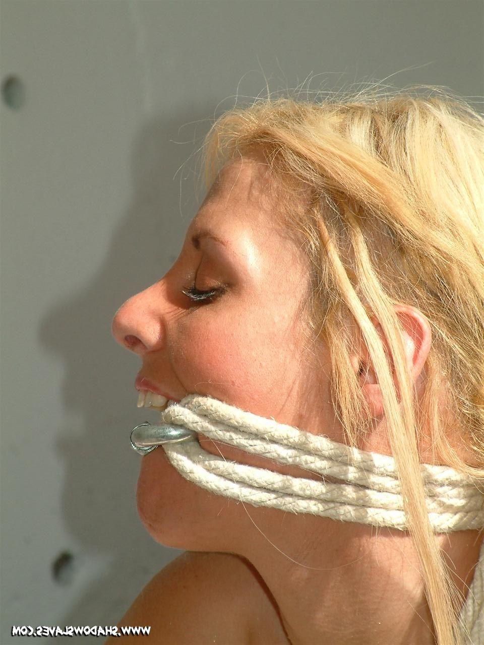 15P Blonde slave tied up with ropes in the sunlight