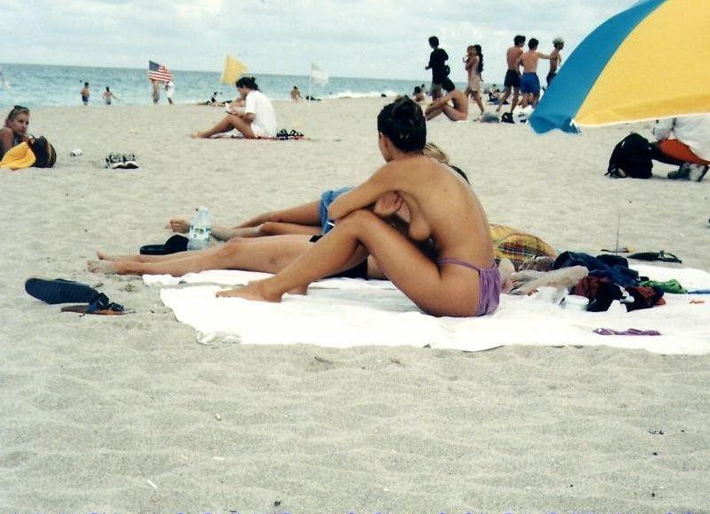 15P Long haired hottie shows her goods at the beach