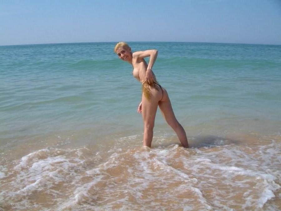 15P Raven haired goddess nudist shows off her body