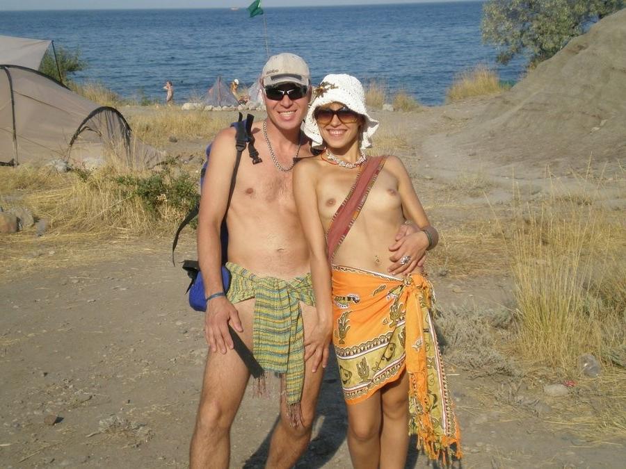 15P Long haired hottie shows her goods at the beach