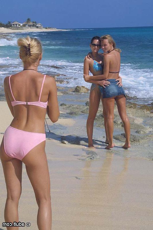 16P Three sexy bikini babes play around on a beach