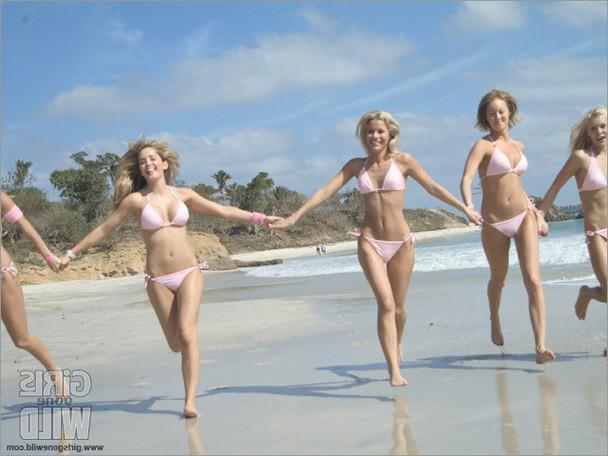 15P Cute babes in bikinis on the warm beach sand