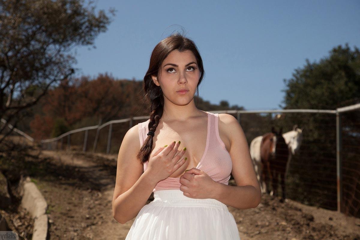 12P Curvy cowgirl posing in a white skirt