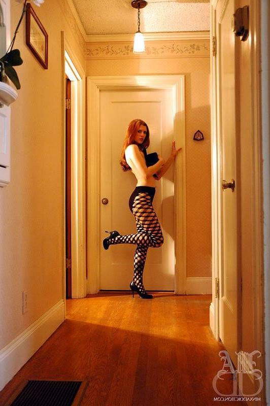 12P Young glamour redhead Minx in fishnets