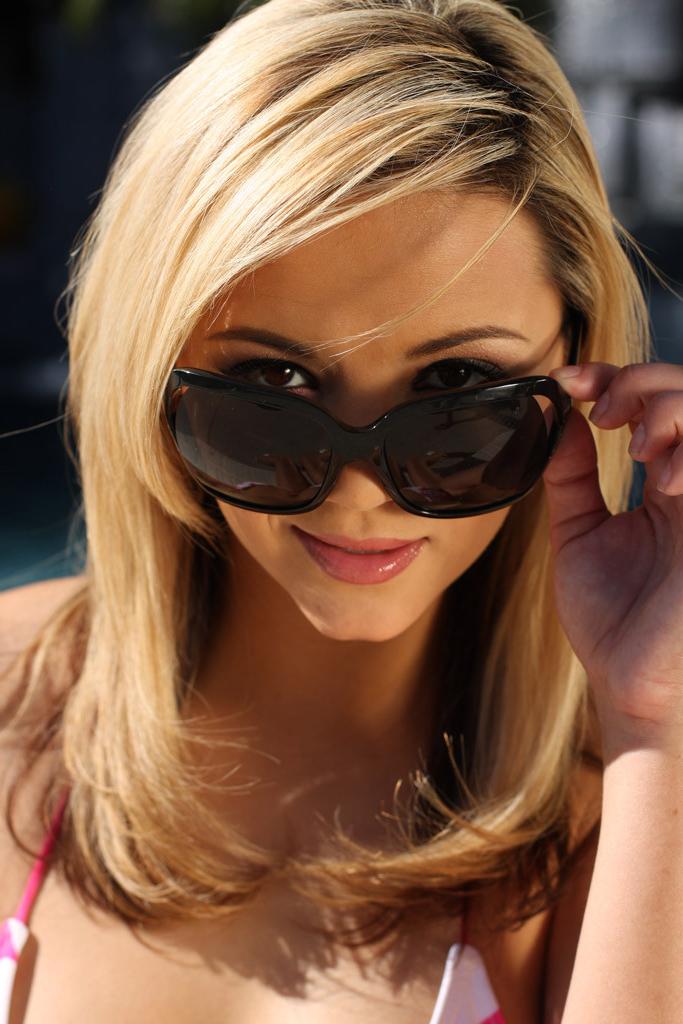 15P Ashlynn Brooke posing in a sexy pink bikini