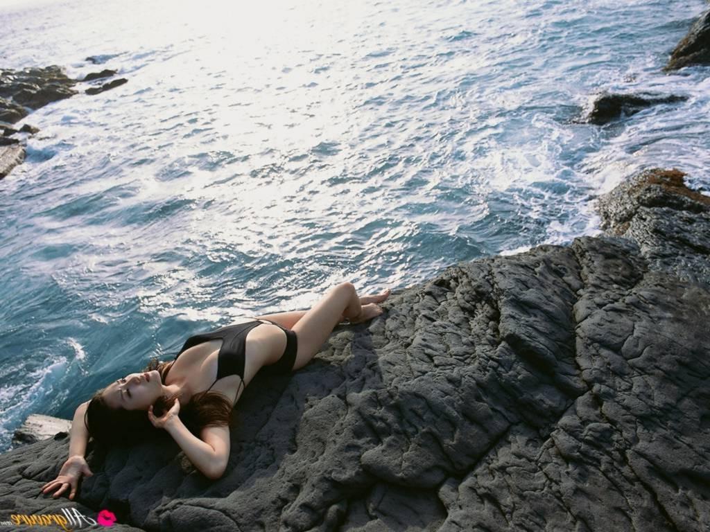 16P Japanese brunette model wet in bikini on the beach
