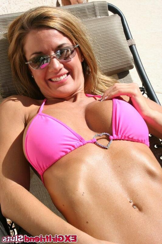 16P Sexy babe takes off her bikini top while sunbathing