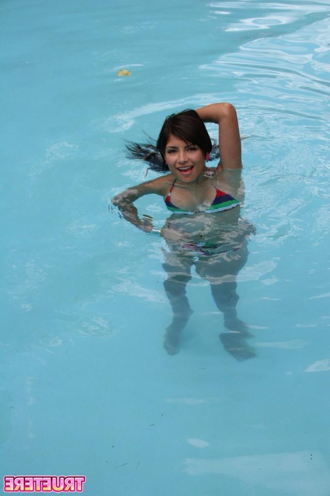 16P Bikini teen girl swimming in pool