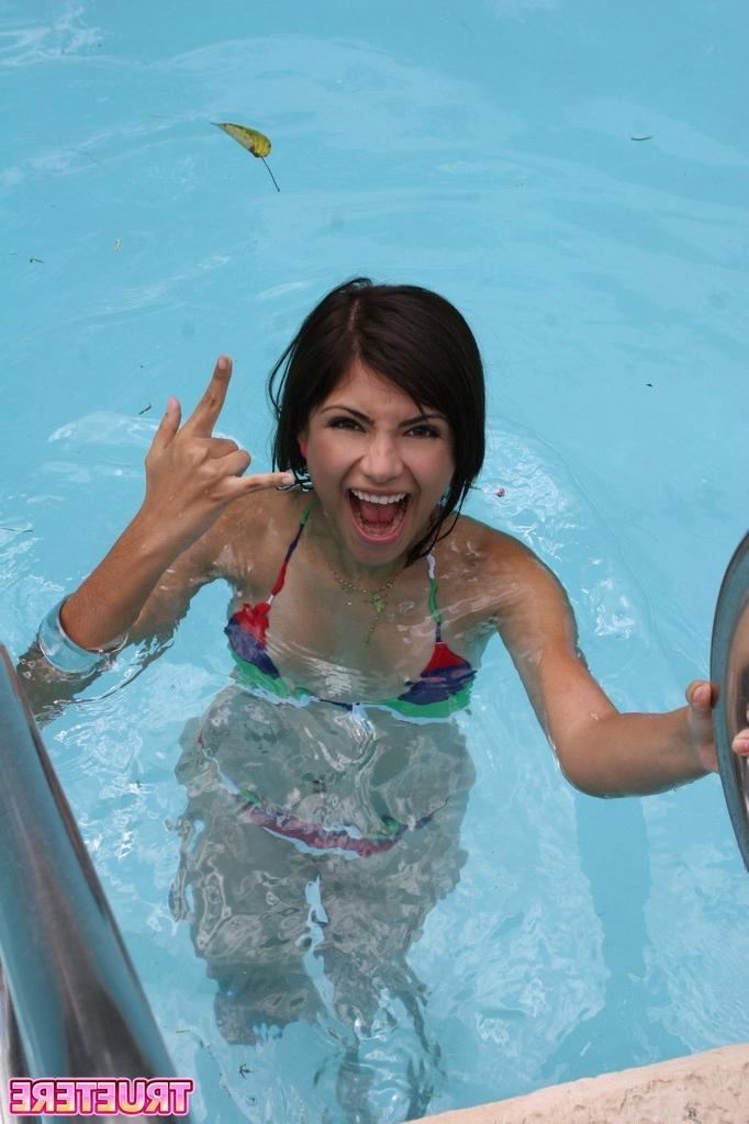 16P Bikini teen girl swimming in pool